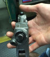 Laser marking a brake rocker arm component